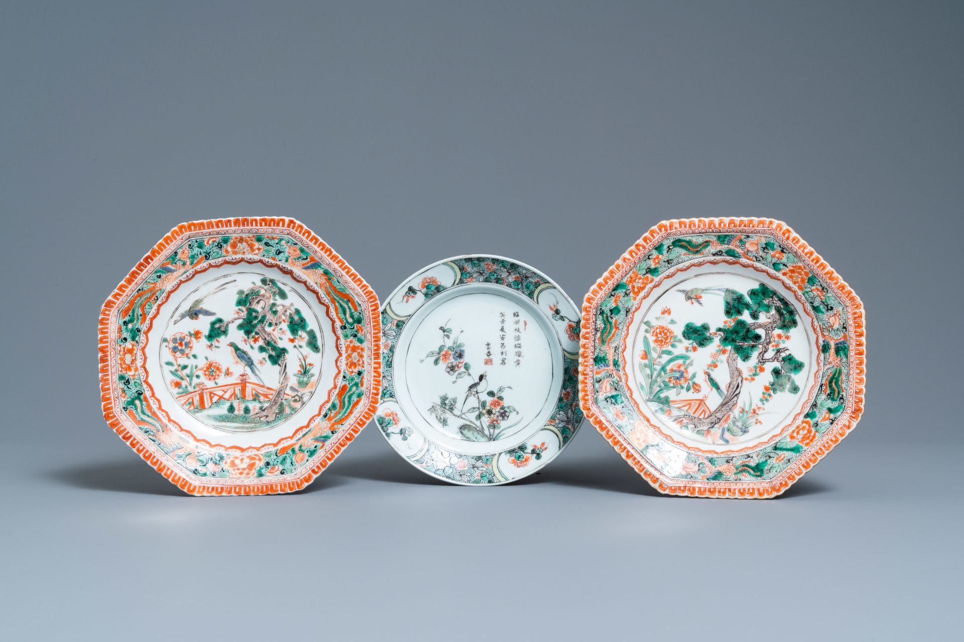 Two Chinese octagonal famille verte dishes and a 'poem' plate, Kangxi