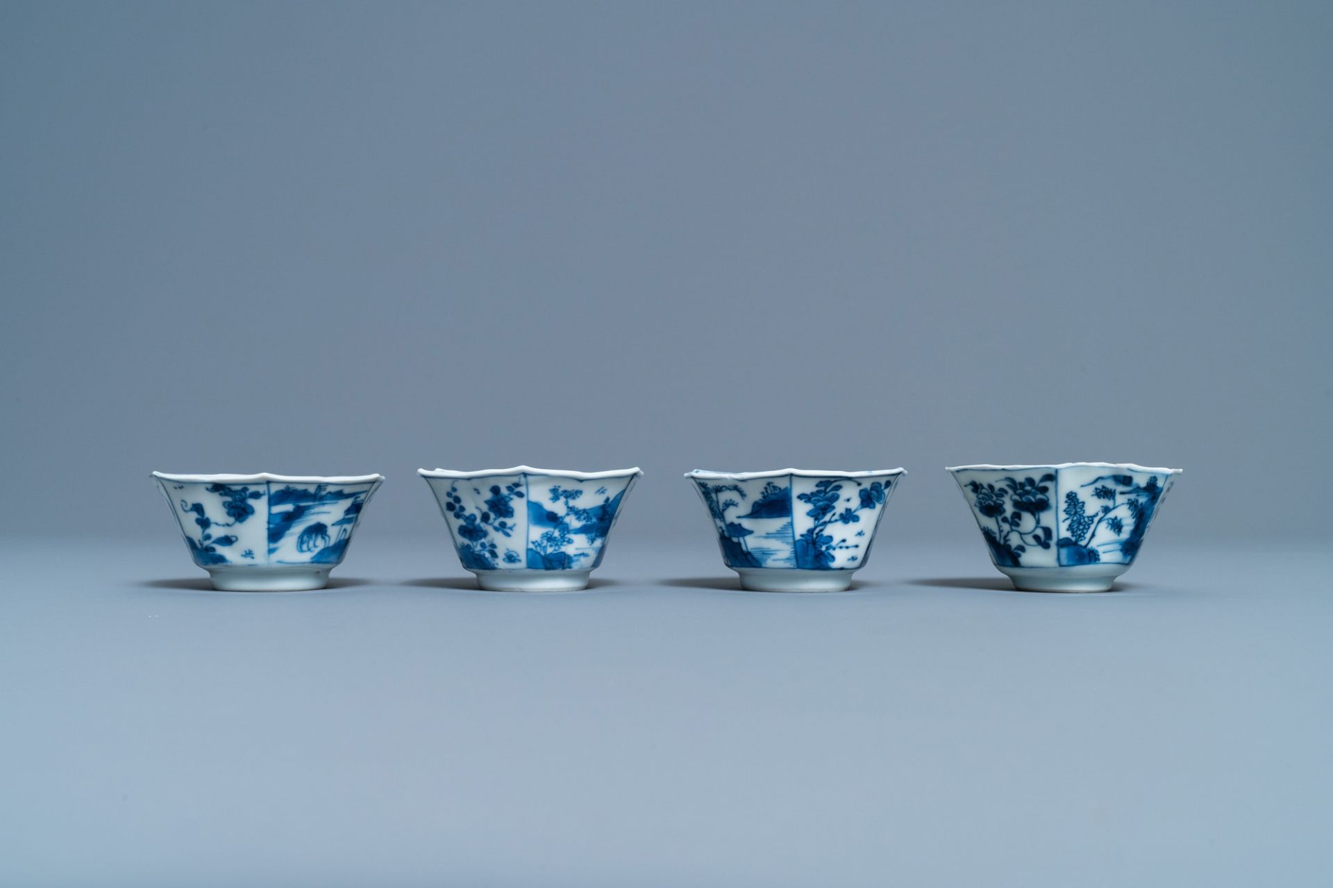 A pair of Chinese blue and white vases, a 'lotus' dish and four cups, Kangxi - Image 13 of 15
