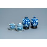 A pair of Chinese blue and white covered bowls on stands and a pair of covered jars, 19th C.