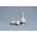 A pair of Chinese famille rose miniature vases and covers and a millefleur vase, Qianlong marks, Rep