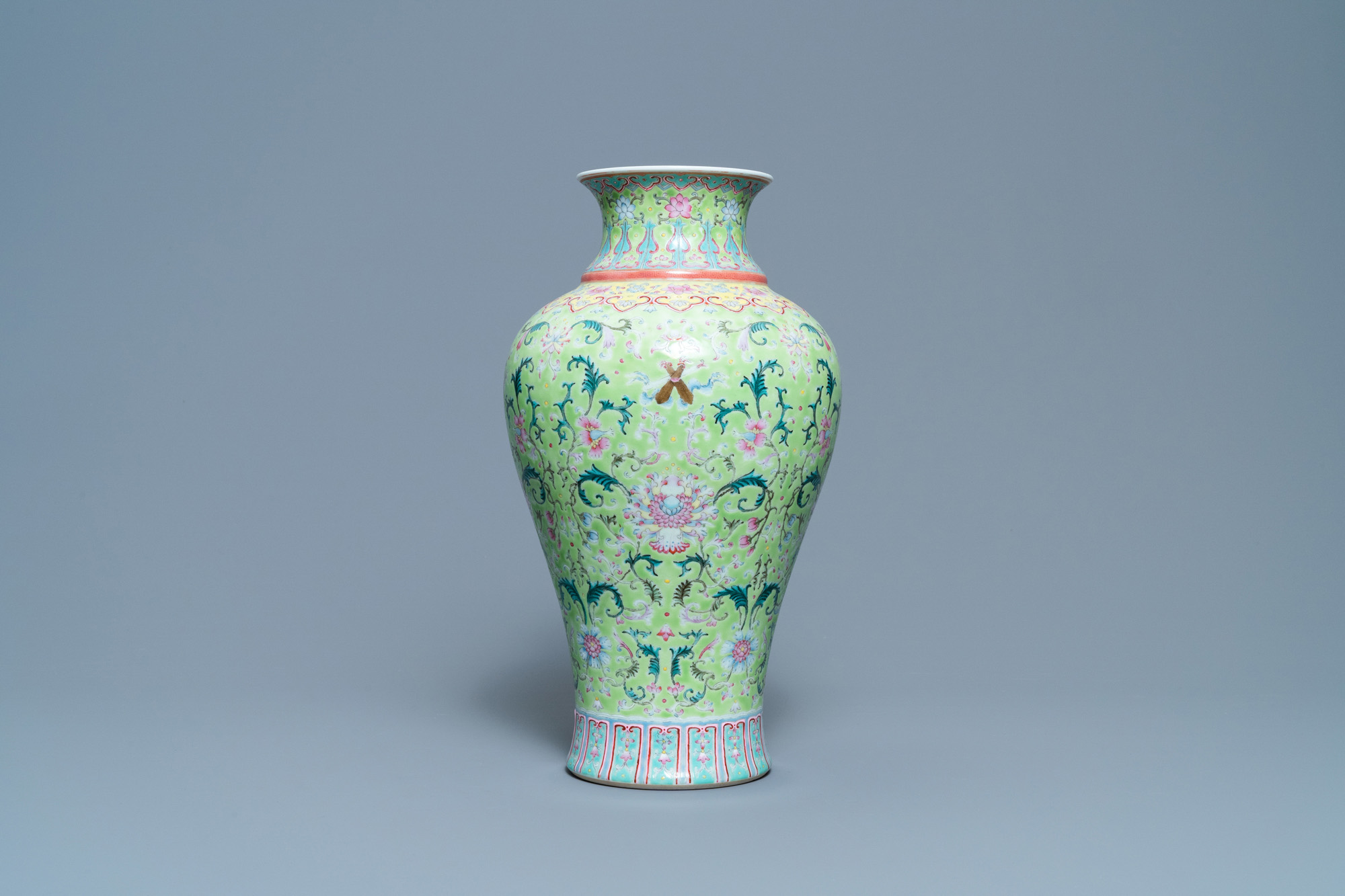 A Chinese famille rose lime-green-ground vase, Qianlong mark, 19/20th C. - Image 2 of 6