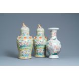 A pair of Chinese Canton famille rose yellow-ground vases and a 'warrior' vase, Qianlong mark, 19th