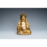 A Chinese gilt bronze figure of the seated Buddha, Ming