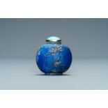 A Chinese lapis lazuli snuff bottle with gilt base, Qing