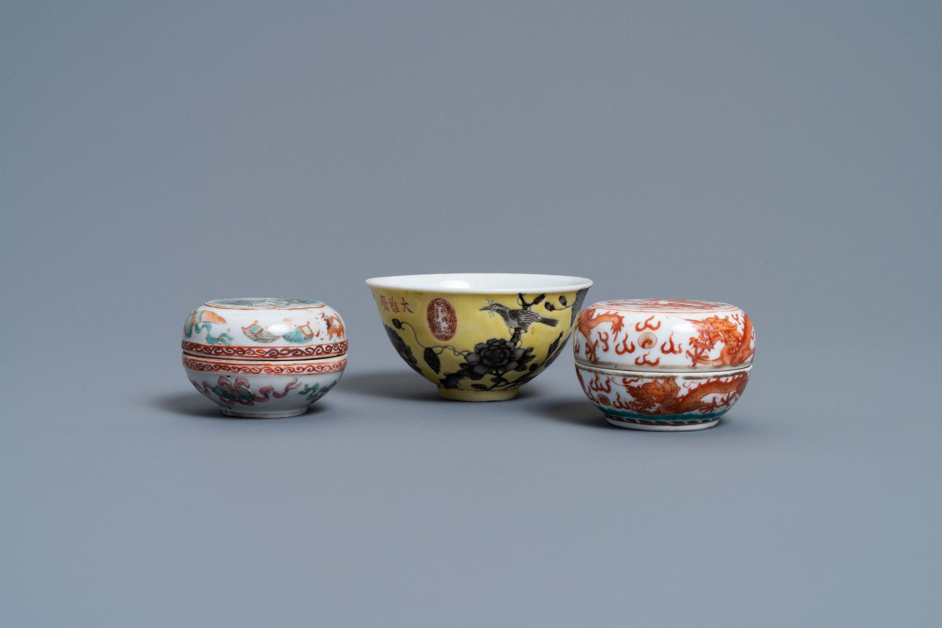 A Chinese Dayazhai yellow-ground bowl and two seal paste boxes, 19th C.