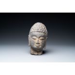 A Chinese stone carving of a Buddha head, Ming