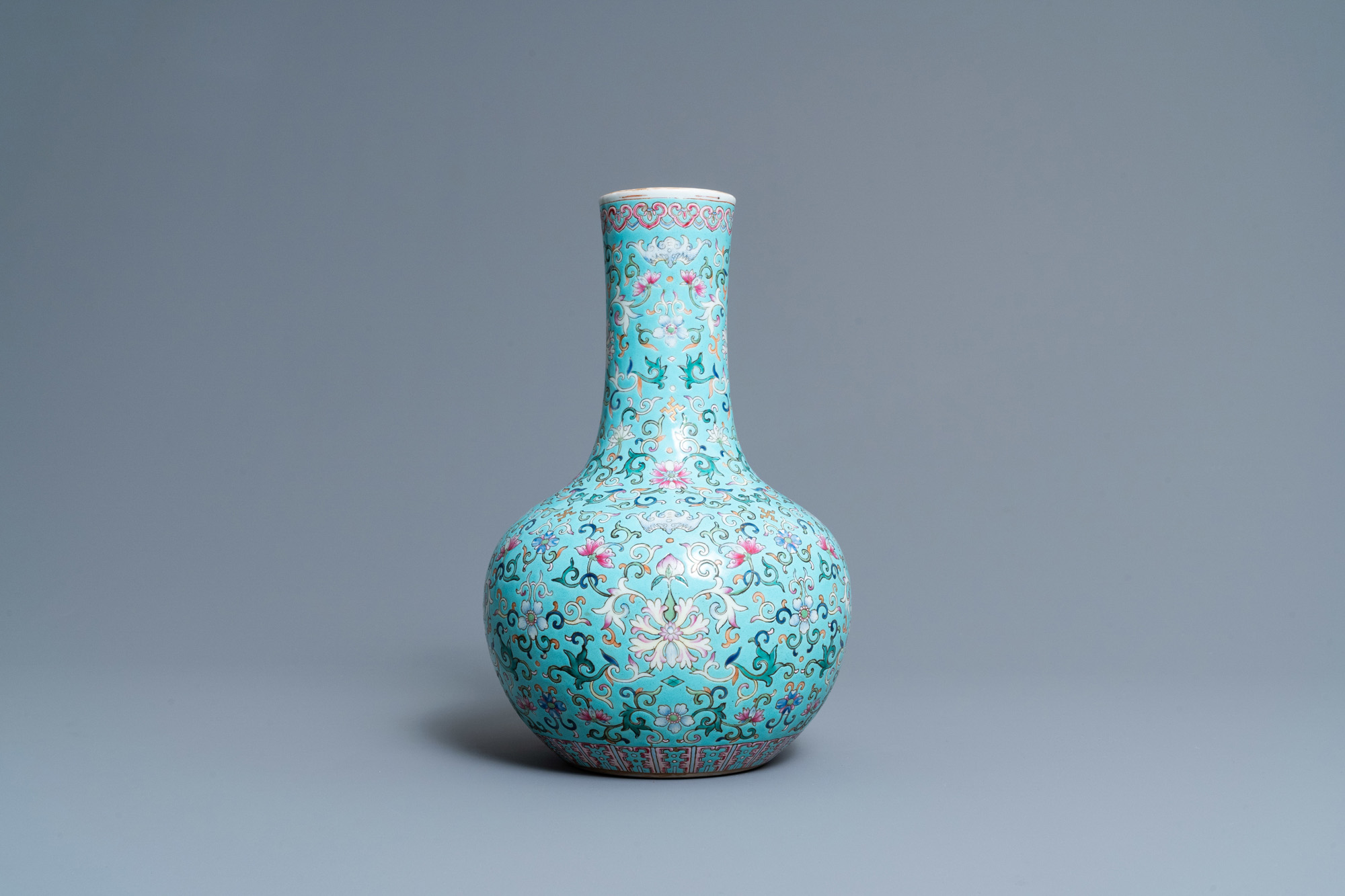 A Chinese famille rose turquoise-ground bottle vase, Qianlong mark, 19th C. - Image 4 of 6