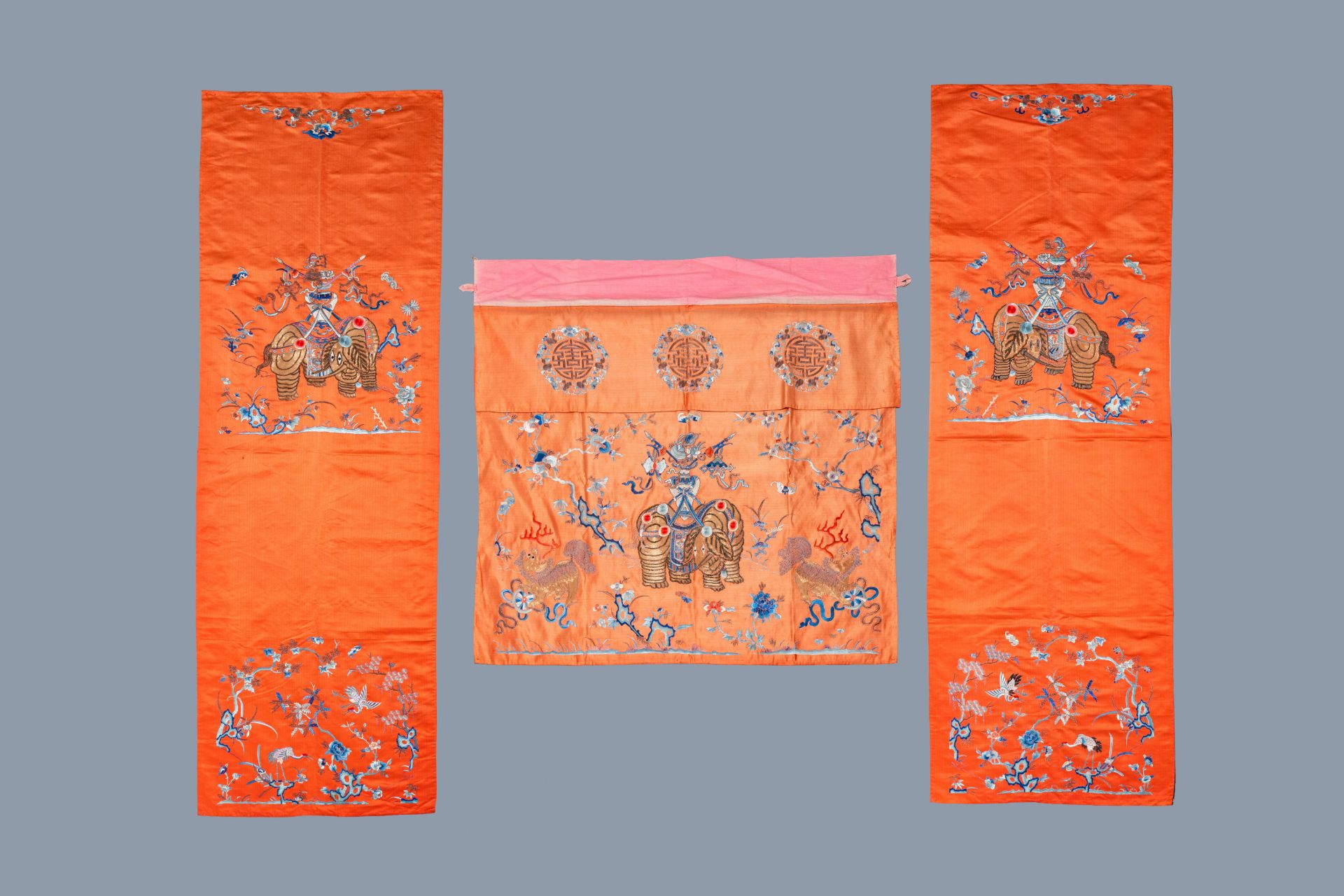 Three Chinese embroidered silk panels with elephants and buddhist lions, 19th C.