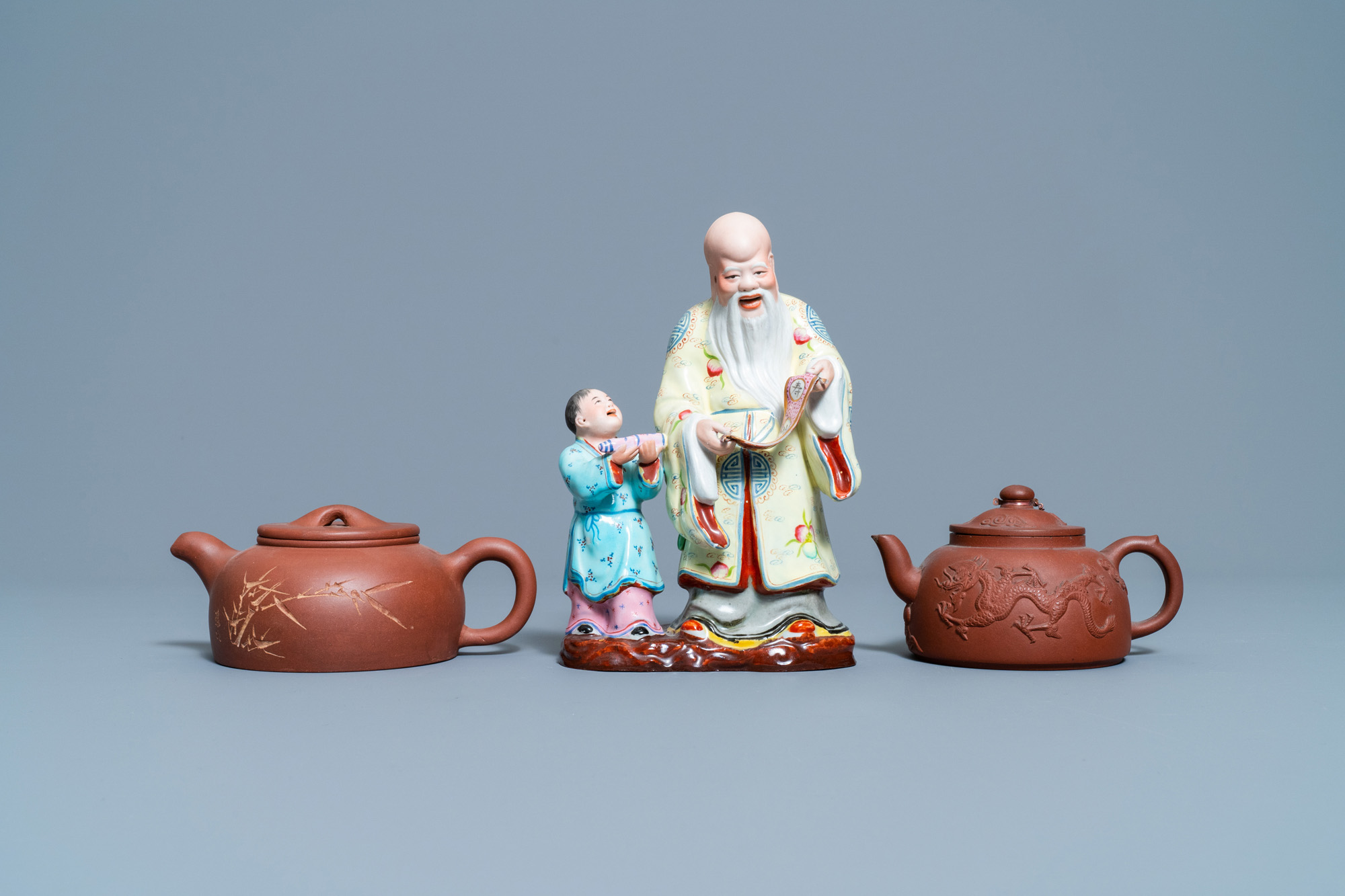 Two Chinese Yixing stoneware teapots and a famille rose 'Shou Lao' group, Kangxi and 20th C. - Image 2 of 7