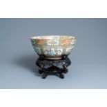 A large Chinese Canton famille rose bowl on wooden stand, 19th C.