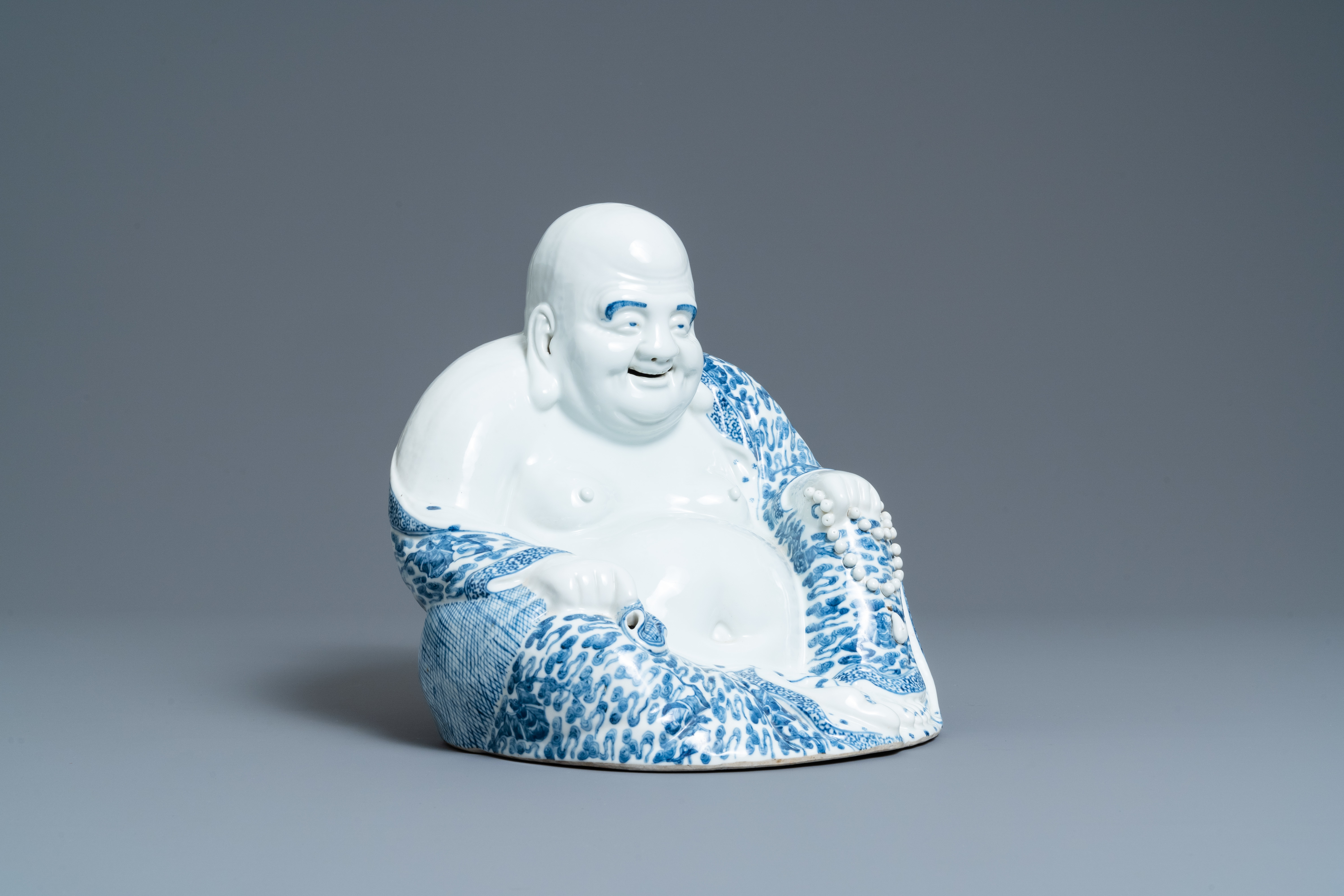 A large Chinese blue and white figure of Buddha, Fujian Huiguang mark, Republic