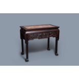 A Chinese wooden marble top table, 19/20th C.