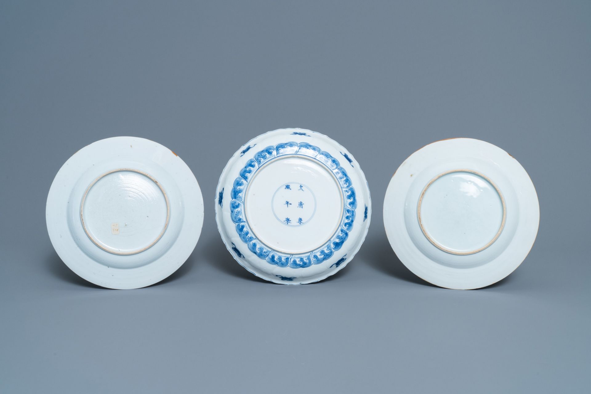 A pair of Chinese famille rose plates, Qianlong, and a blue and white plate, Kangxi mark and of the - Image 3 of 3