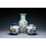 A Chinese famille rose vase and a pair of famille verte powder blue-ground jars, 19th C.