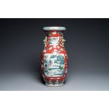 A Chinese famille rose ruby-ground vase, 19th C.