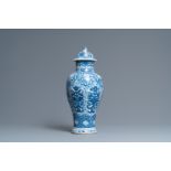 A Chinese blue and white vase and cover with floral design, Kangxi