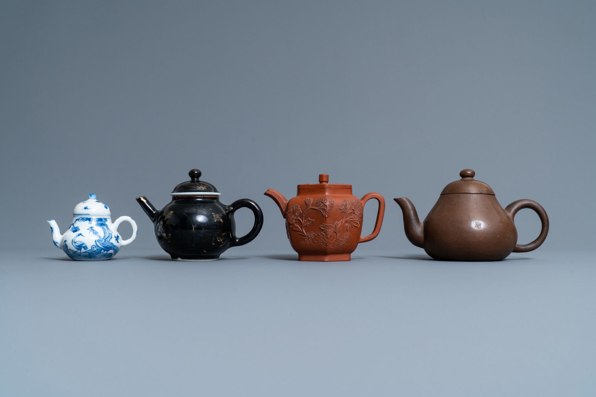 Four Chinese Yixing stoneware, blue and white and monochrome black porcelain teapots, Kangxi and lat - Image 2 of 9
