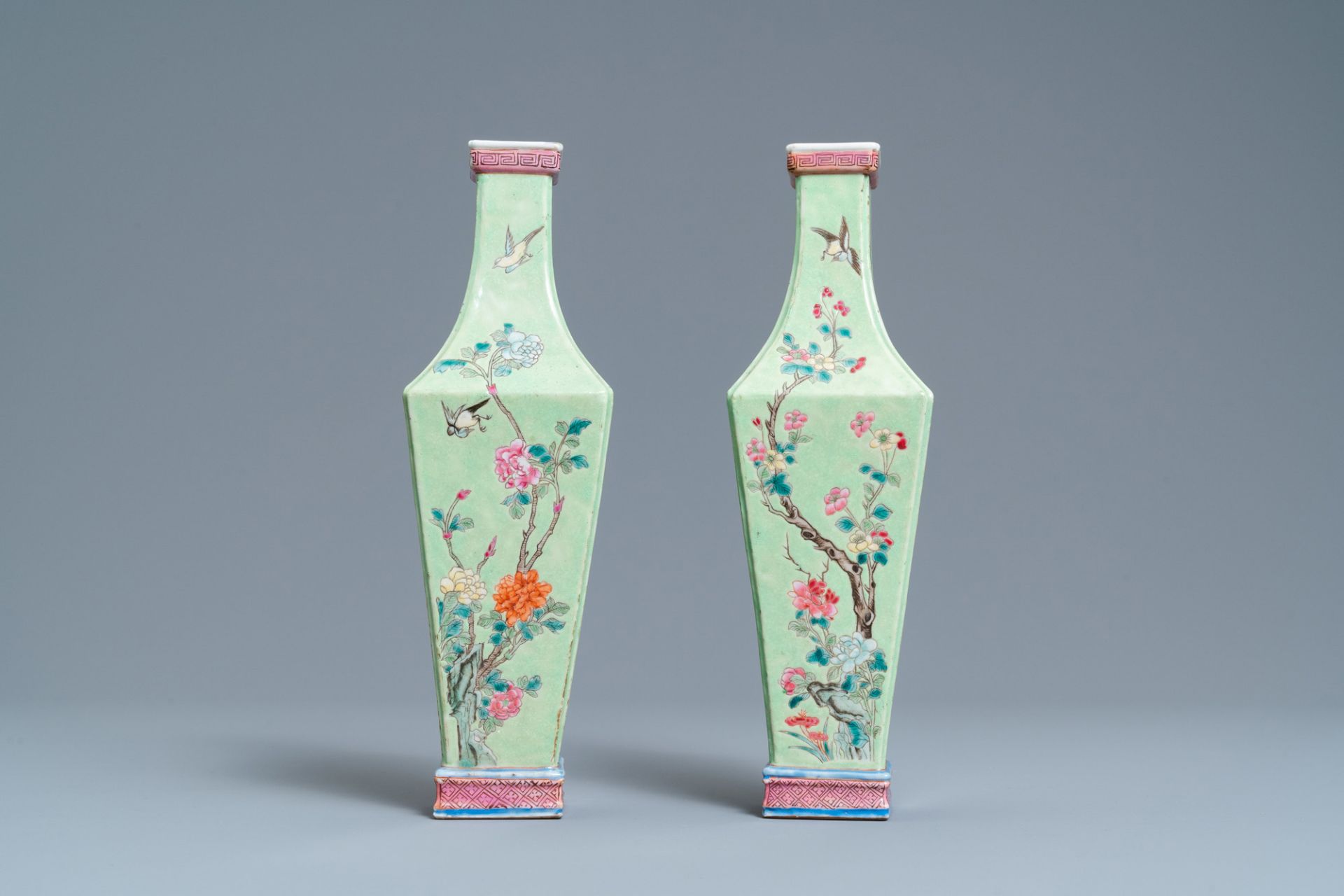 A pair of Chinese famille rose green-ground vases with floral design, 19th C. - Image 3 of 6