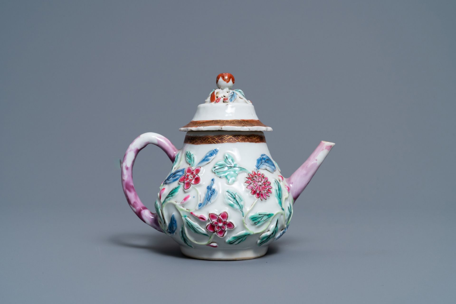 A Chinese famille rose relief-decorated teapot on stand, Yongzheng - Image 7 of 10