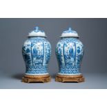 A pair of large Chinese blue and white covered vases, 19th C.