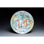 A large Chinese famille rose dish with figures in front of a temple, Yongzheng