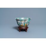 A Chinese verte biscuit bowl on wooden stand, 19th C.