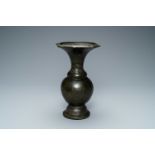 A Chinese bronze vase with incised taotie masks, Song/Yuan