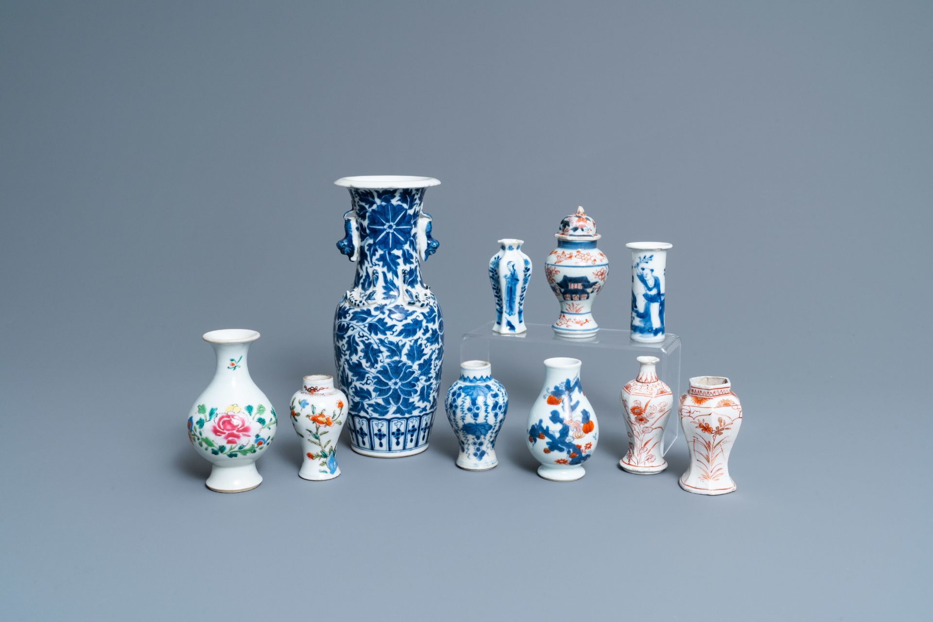 Ten mostly Chinese blue and white, famille rose and Imari-style vases, Kangxi and later