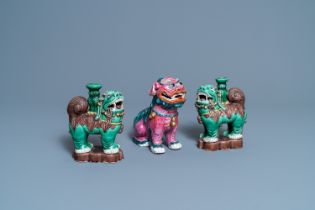 A Chinese famille rose model of a Buddhist lion and a pair of verte biscuit joss stick holders, 19th