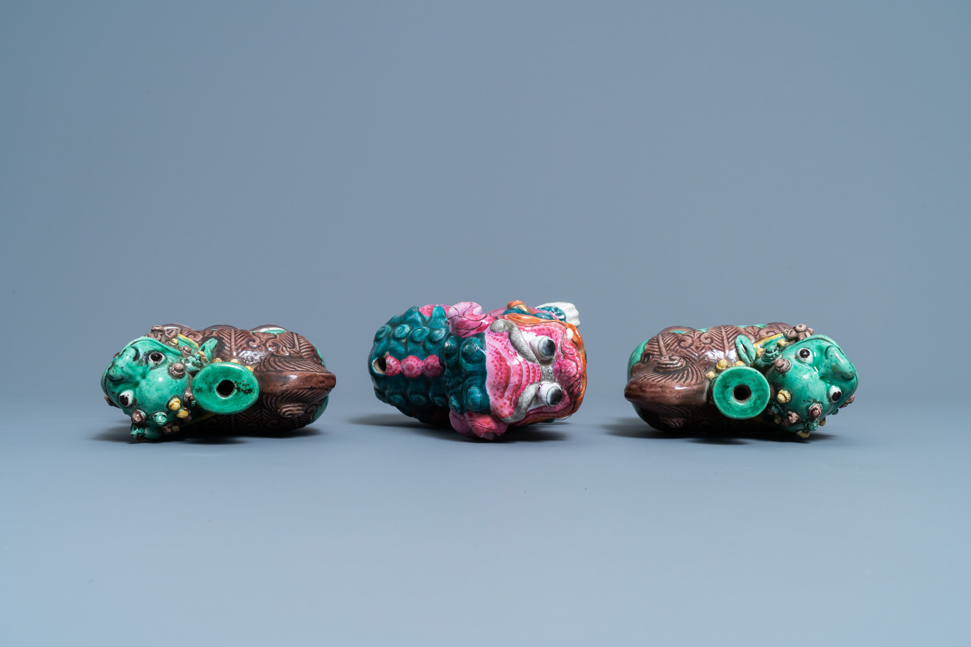 A Chinese famille rose model of a Buddhist lion and a pair of verte biscuit joss stick holders, 19th - Image 7 of 7