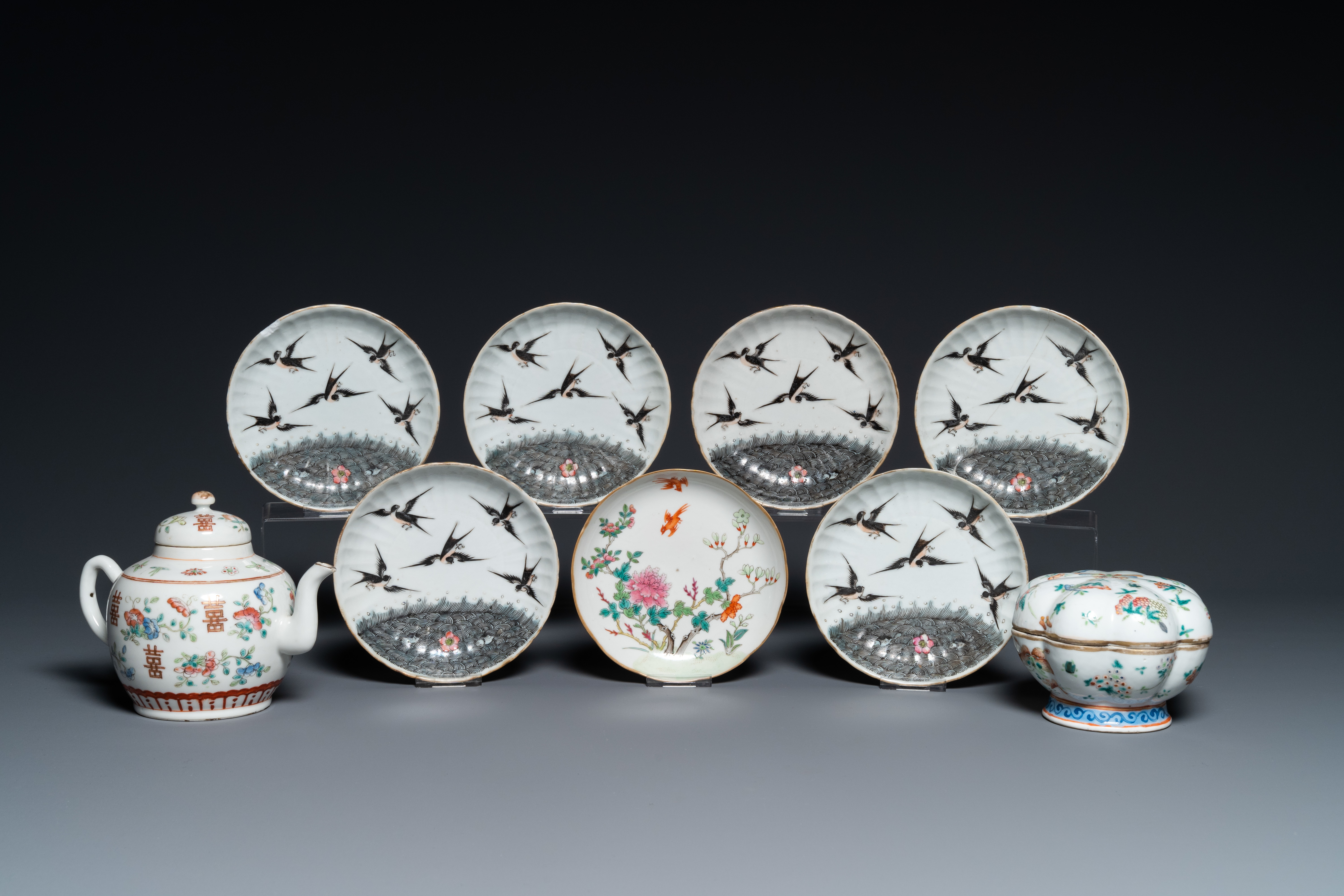 Seven Chinese famille rose saucers, a teapot and a covered box, 19th C.