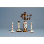 Three Chinese Canton famille rose candlesticks and a vase with gilt bronze mounts, 19e eeuw