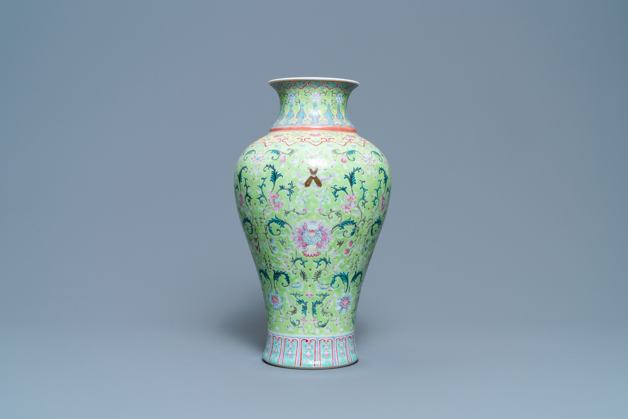 A Chinese famille rose lime-green-ground vase, Qianlong mark, 19/20th C. - Image 3 of 6