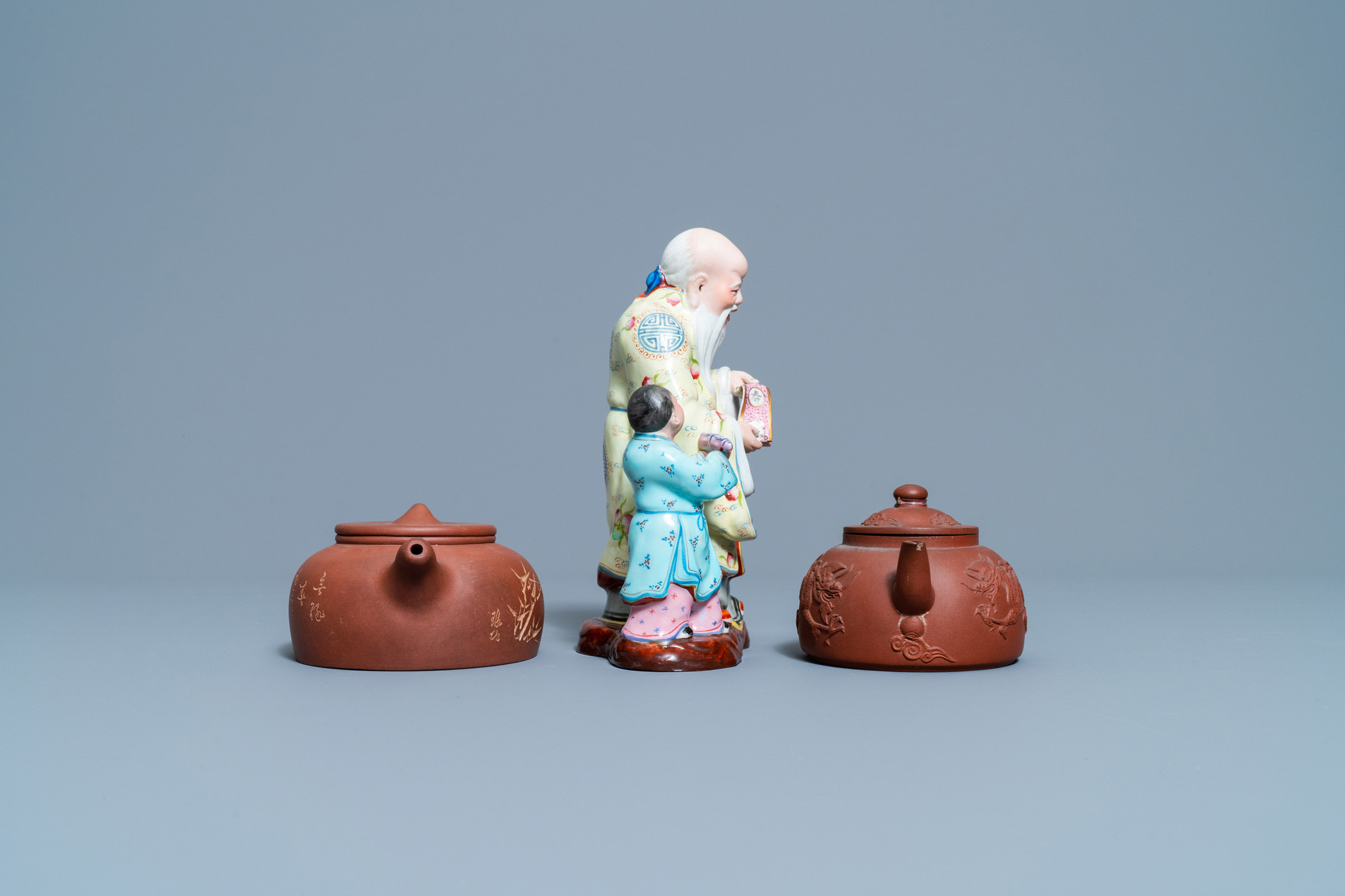 Two Chinese Yixing stoneware teapots and a famille rose 'Shou Lao' group, Kangxi and 20th C. - Image 5 of 7