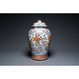 An exceptionally large Chinese Imari-style vase and cover with molded floral design, Kangxi