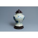 A Chinese blue, white and copper-red celadon-ground 'birds and deer' vase, Kangxi