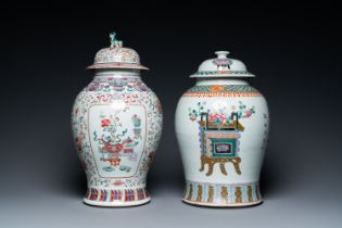 Two Chinese famille rose vases and covers, 19th C.