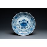 A Chinese blue and white 'lotus bouquet' dish, Qianlong/Jiaqing