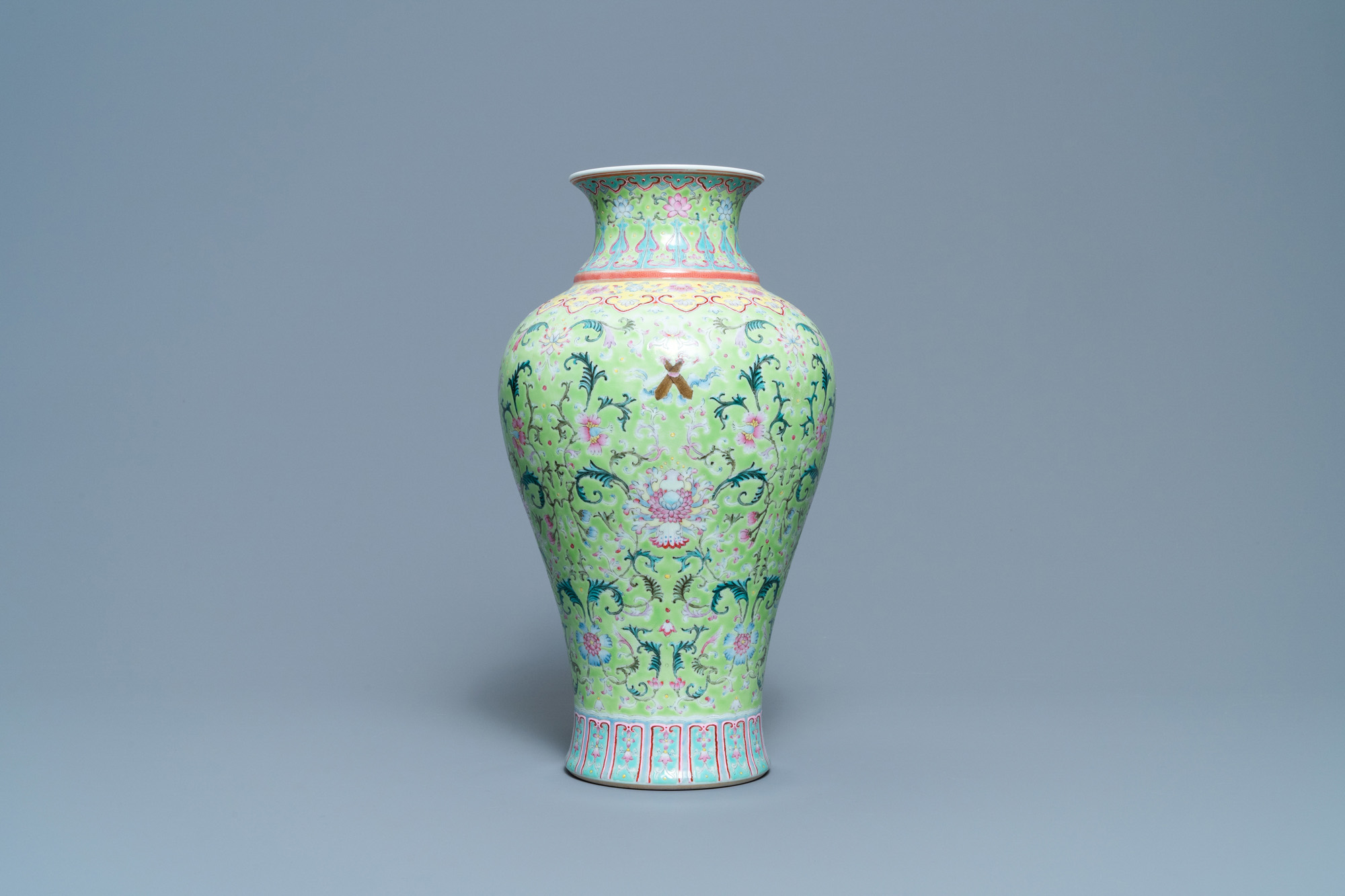 A Chinese famille rose lime-green-ground vase, Qianlong mark, 19/20th C. - Image 4 of 6