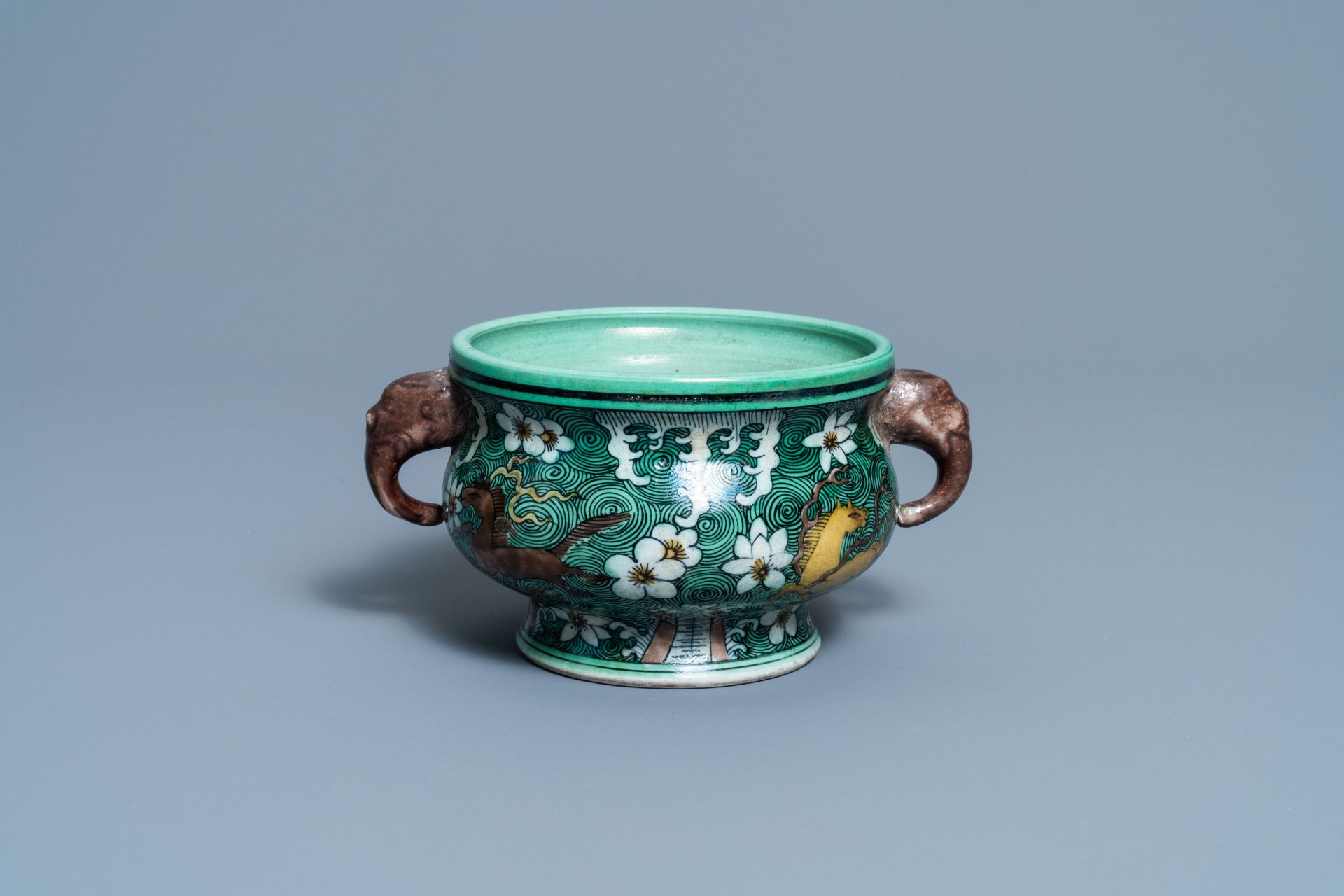 A Chinese verte biscuit 'flaming horses' censer, Jiajing mark, 18/19th C.