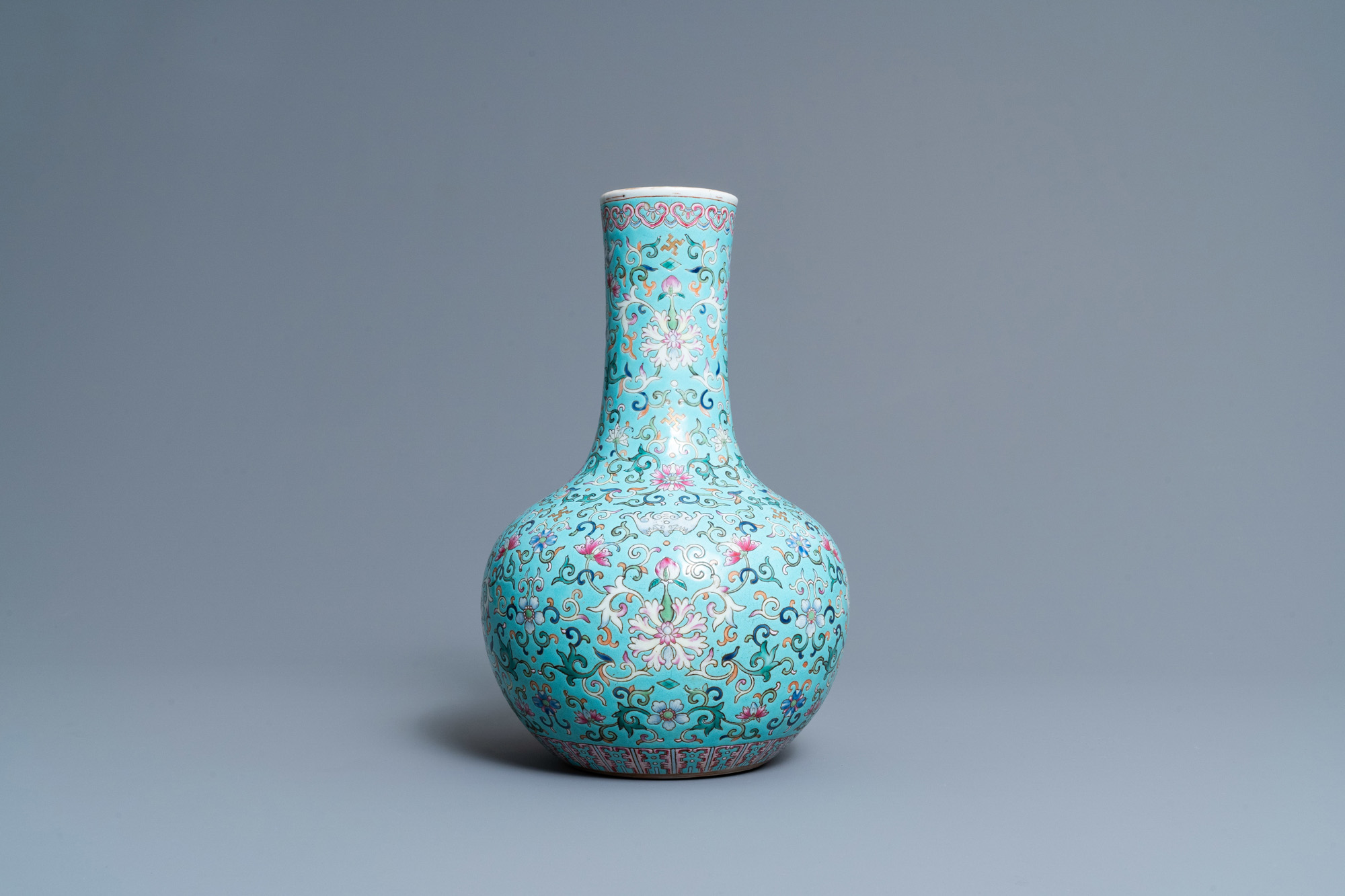 A Chinese famille rose turquoise-ground bottle vase, Qianlong mark, 19th C. - Image 3 of 6