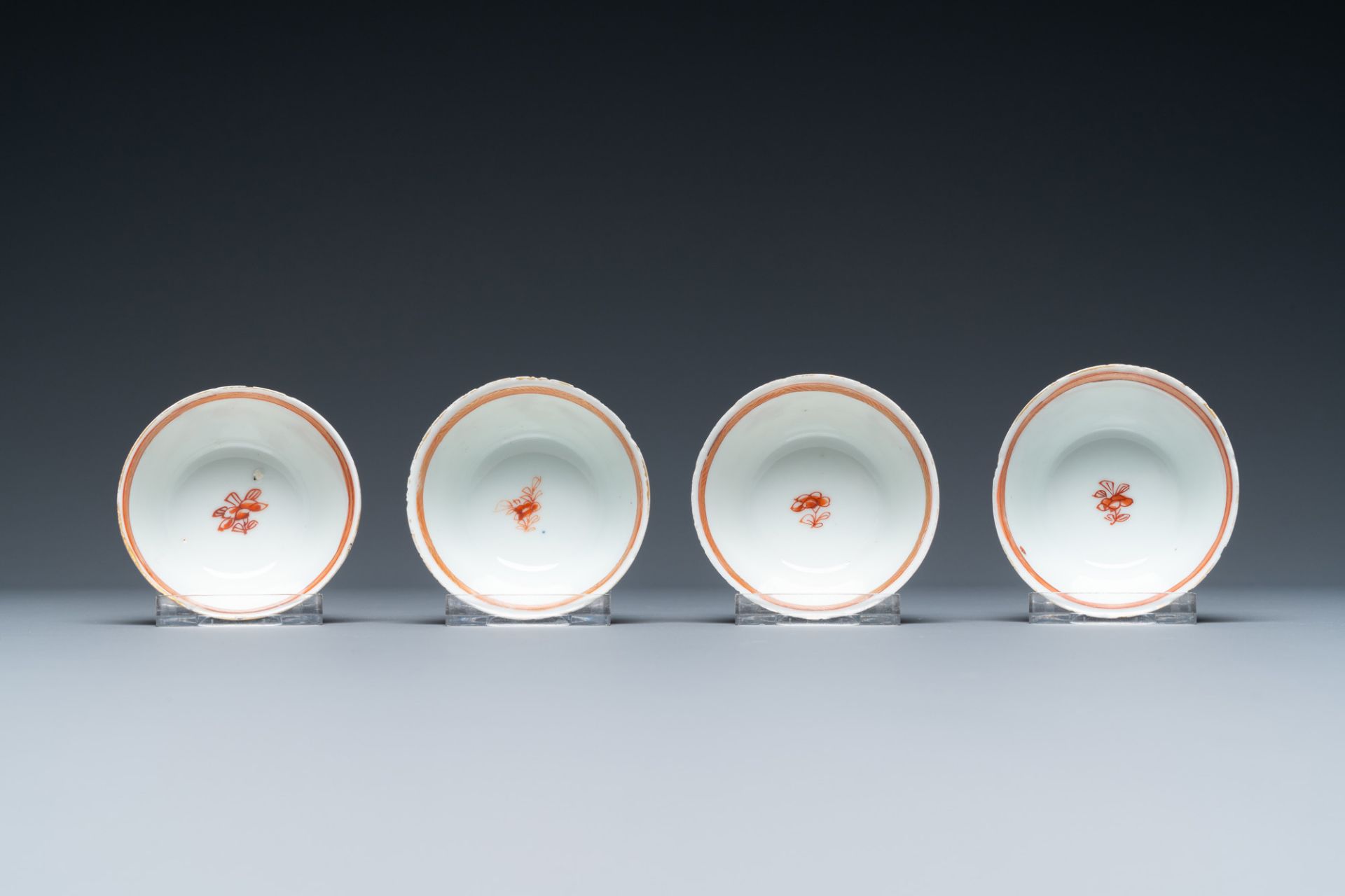 Four Chinese iron-red and gilt cups and saucers with figures near a table, Kangxi - Image 9 of 9