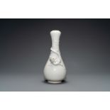 A Chinese Dehua blanc de Chine vase with applied dragon, Kangxi/Yongzheng