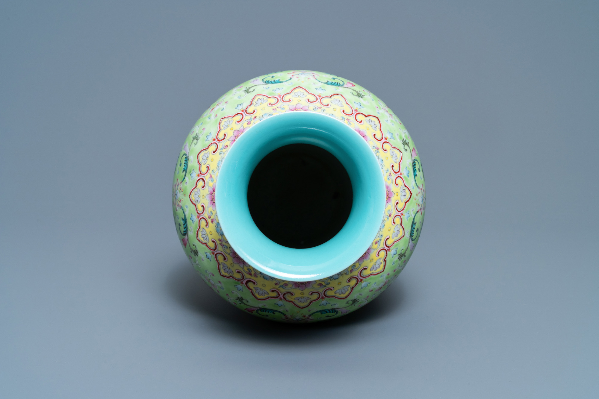 A Chinese famille rose lime-green-ground vase, Qianlong mark, 19/20th C. - Image 5 of 6