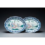 A pair of Chinese oval famille rose dishes with a lady in a garden, Qianlong