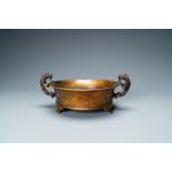 A large Chinese bronze tripod censer with chilong handles, Xuande mark, 18/19th C.