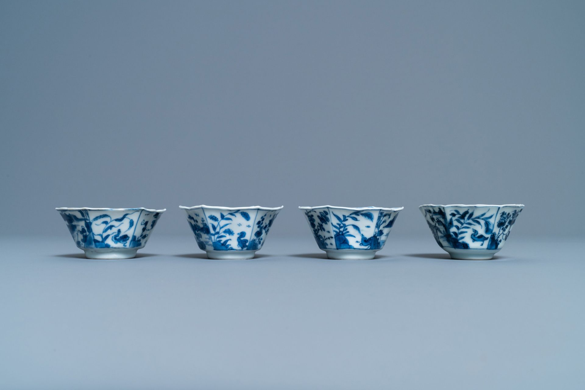 A pair of Chinese blue and white vases, a 'lotus' dish and four cups, Kangxi - Image 10 of 15
