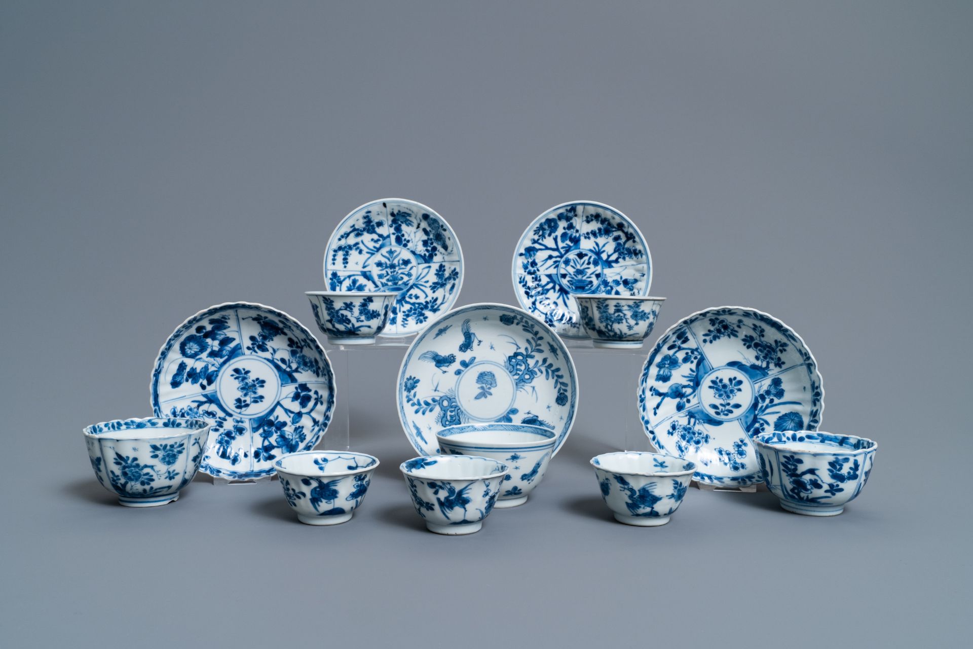 Eight Chinese blue and white cups and five saucers, Kangxi