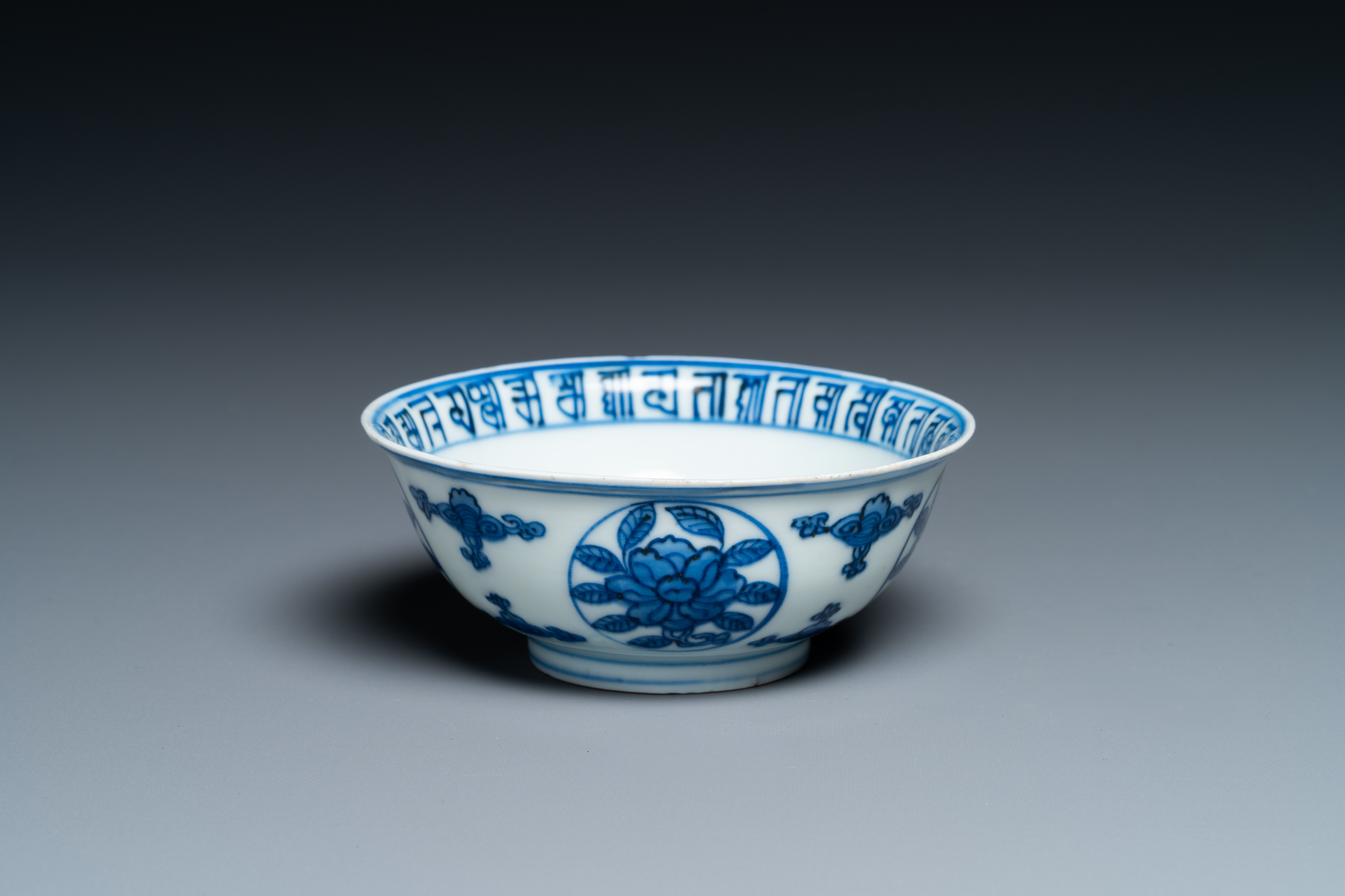 A Chinese blue and white 'dragon' bowl with lanca-characters, Wanli mark and of the period - Image 4 of 9