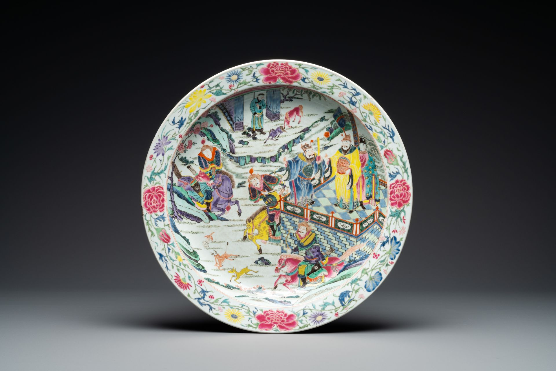 A large Chinese famille rose 'deer hunt' dish, Yongzheng